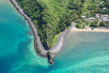 Coastal road facing the turquoise lagoon, aerial view by drone, Bel Ombre, Baie Du Cap, South...