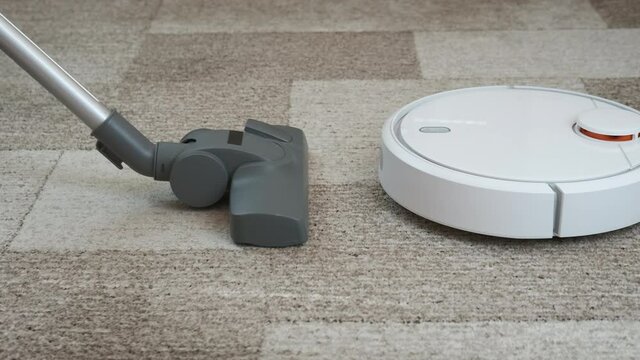 Robot vacuum cleaner with an old vacuum cleaner.