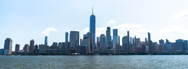 Panorama on manhattan skyline from hudson river with blue sky and summer cloud