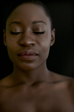 Black woman with eyes closed