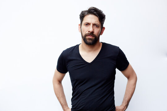 Caucasian man standing with hands on hips