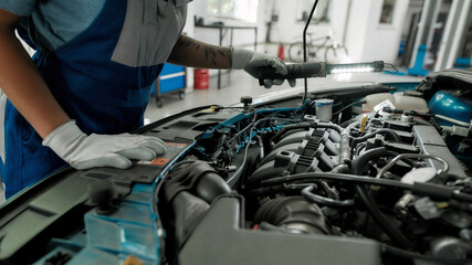 Serve to drive better. Cropped shot of african american woman, professional female mechanic...