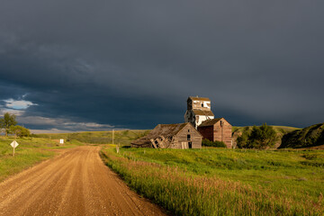Old abandoned grain elevator in the badlands ghost town of Sharples, Alberta. 