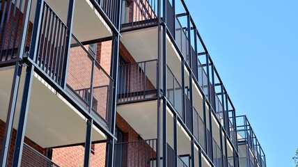 Modern apartment buildings on a sunny day with a blue sky. Facade of a modern apartment building....