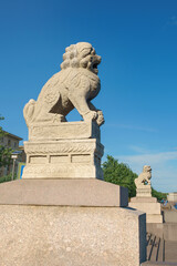 Fototapeta na wymiar sculpture of a lion on the embankment of the Neva River. Unique urban landscape of St. Petersburg