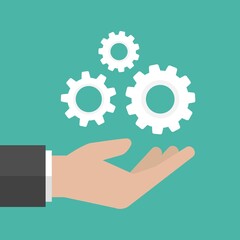 Hand hold gear. Installation and support icon isolated on blue.