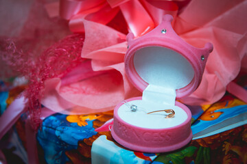 Wedding accessories. Golden pin in a box