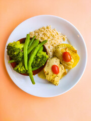 healthy dish with fish rice and vegetables