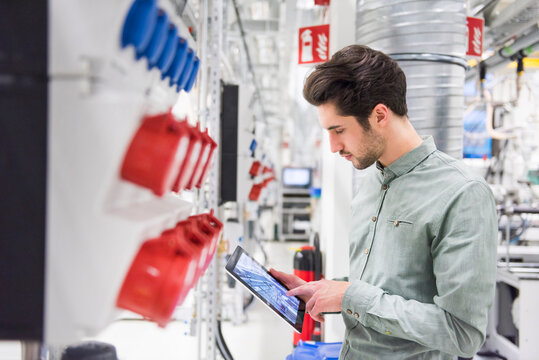 Man using tablet in a factory