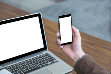 Mock up image of male hand holding blank screen smart phone.