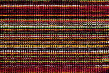 Line weave texture in shades of red, green, purple, pink, yellow