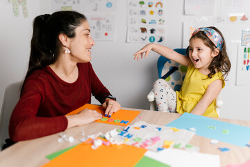 Mother and daughter doing crafts at home