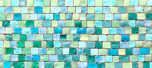 Ceramic mosaic tiles texture or background. Colorful blue and green pastel mosaic wall.