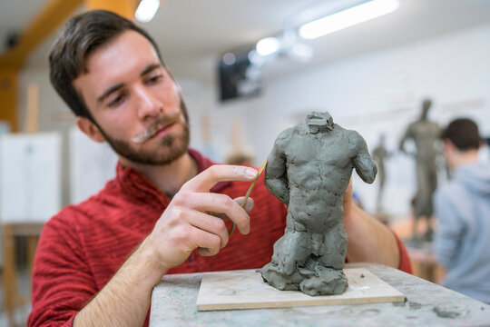 Student forming sculpture