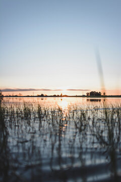 Scenic view of lake against clear blue sky during sunset at Evora, Portugal