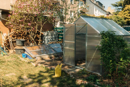 Small Greenhouse At Yard Outside House