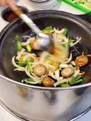 Stirring traditional hot pot in Taiwan