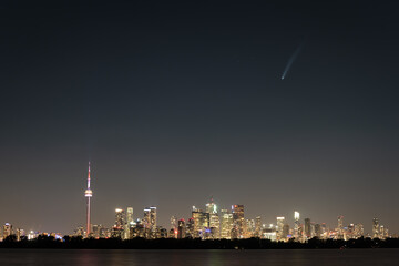 Comet NEOWISE flies over the skyline of Toronto, Ontario, as seen from Tommy Thompson Park.