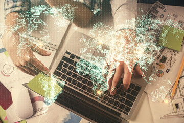 Double exposure of man and woman working together and social network theme hologram drawing. Computer background. connecting concept. Top View.