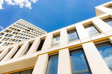 exterior facade landmark view urban city scape photography foreshortening from below on blue sky