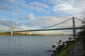 Fort Lee, NJ / United States - Wide angle view of the iconic George Washington Bridge. The bridge is a double-decked suspension bridge spanning the Hudson River, connecting the New York City to N.J.
