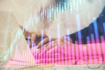 Multi exposure of woman hands typing on computer and financial graph hologram drawing. Stock market analysis concept.