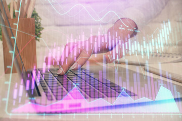 Multi exposure of woman hands typing on computer and forex chart hologram drawing. Stock market...