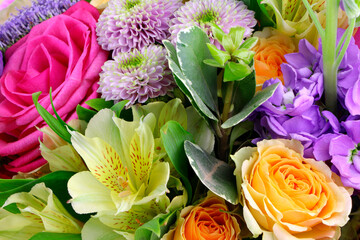 Modern floral bouquet of different flowers, colorful bunch of flowers.Red roses, Chrysanthemum. Freesia and Eustoma