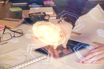 Double exposure of man's hands holding and using a phone and crypto currency blockchain theme drawing.