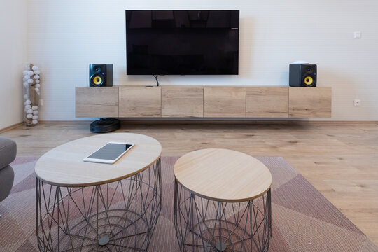 Cabinet And TV With Speakers In Living Room Of Modern Apartment