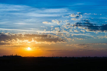 Natural Sunset. Bright Dramatic Sky And Dark Ground. Landscape Under Scenic Colorful Sky. Sun Over Skyline, Horizon. Transcarpathia and Uzhhorod. Magic Sunset. Dusk. Clouds.