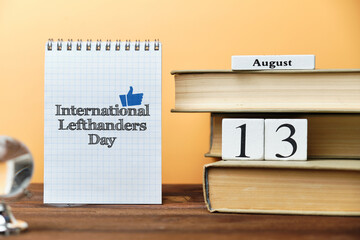 13th august - International Lefthanders Day. Thirteenth day month calendar concept on wooden blocks with copy space.