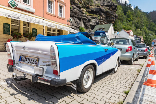 HRENSKO, CZECH REP - JULY 19, 2020. Historic Trabant car modified as a cabriolet. White-blue trabant on a sunny day in Hrensko, Czech Republic.