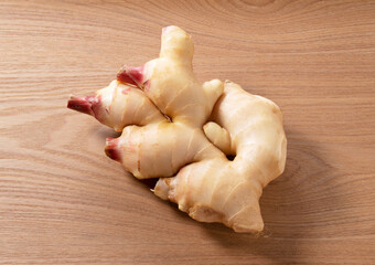 Fresh ginger on a tree background