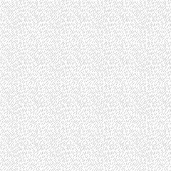 Fototapeta na wymiar Hand drawn small lines in a seamless repeat pattern background
