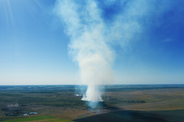 Wildfire, dry grass burns aerial view, natural disaster. Fire from heat in nature.