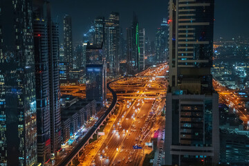 Amazing night Dubai downtown skyline view from above panorama, Dubai, United Arab Emirates.