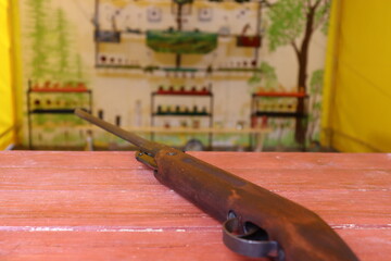 shooting range with gun on table