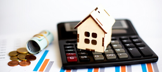 model wooden house and dollar banknote. Image for property real estate investment concept on chart background