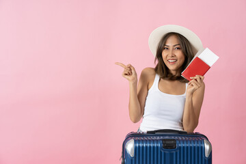 Young brunette girl traveler with luggage case, summer hat give thumbs up in white isolated...