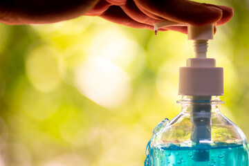 Man using alcohol gel clean wash hand sanitizer anti virus bacteria.