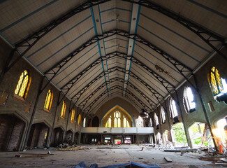 interior of an abandoned church with high roof