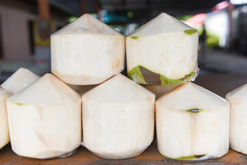 Coconut white for juice drink - Fresh young coconut on wooden table background