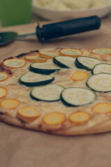 zucchini pizza topped with green and yellow zucchinis