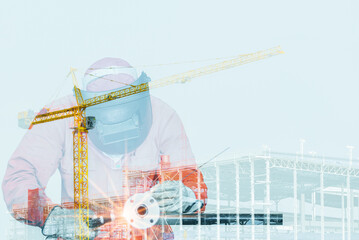 Double exposure of a downtown city and Industrial Worker welding steel structure for industrial and construction concept