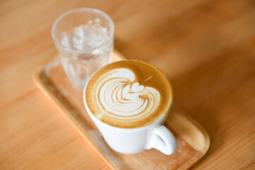 coffee cup top view - cappuccino latte art hot coffee on wooden table background
