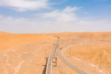 aerial view of road and railway  in the desert