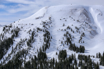 Snow covered ski runs in the backcountry of Colorado in winter