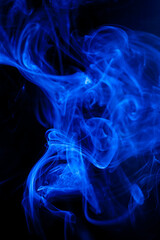 Blue smoke motion on black background.