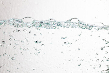 Closeup bubbles underwater on white background.